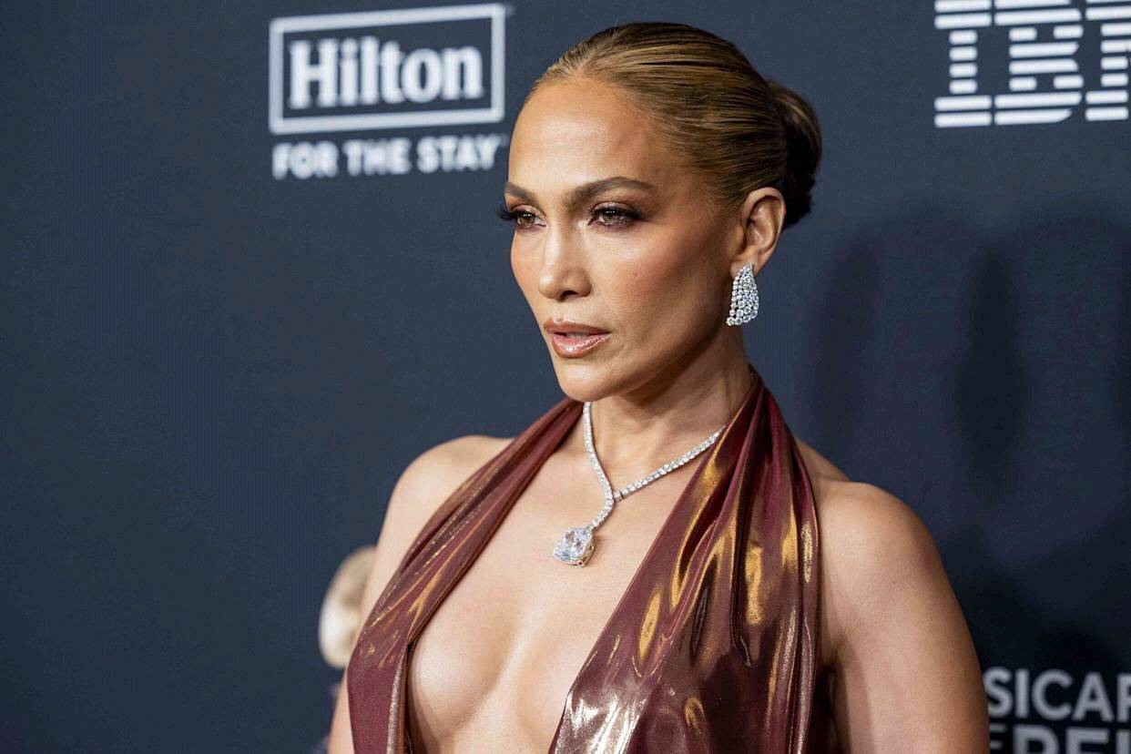  Jennifer Lopez Stuns in Oscar-Inspired Gold Gown at Pre-Oscars Party